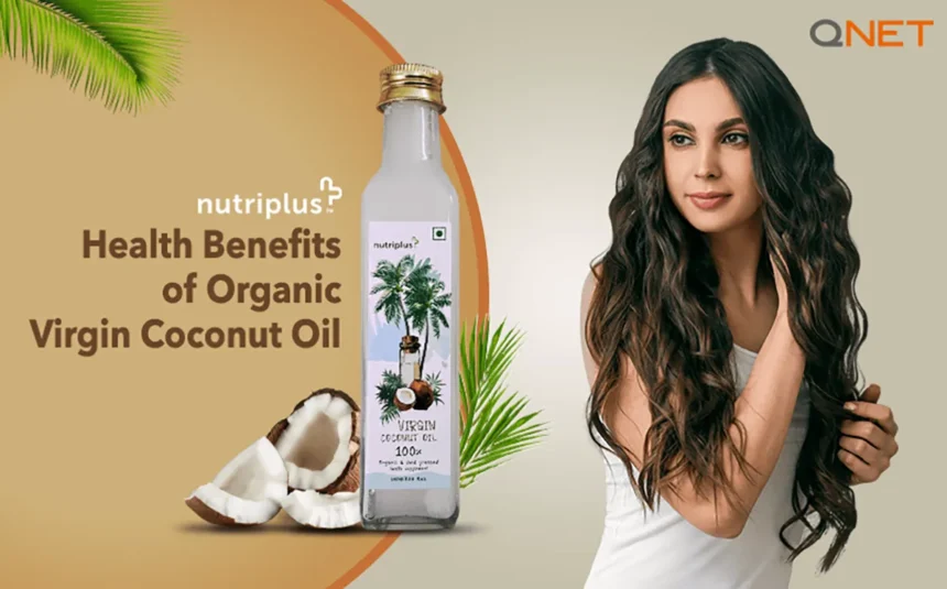 A young woman using virgin coconut oil