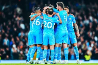 Manchester-City players celebrate after scoring a goal