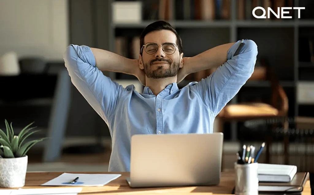 A peaceful man taking a deep breath with his eyes closed | QNET India