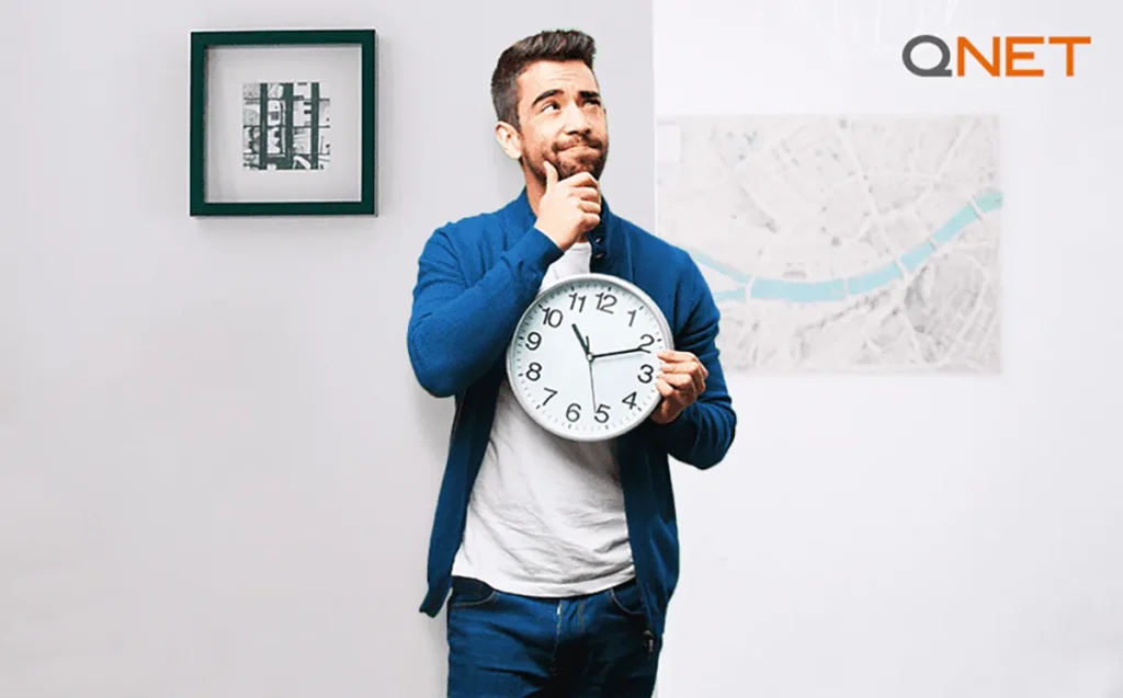 A man holding a clock