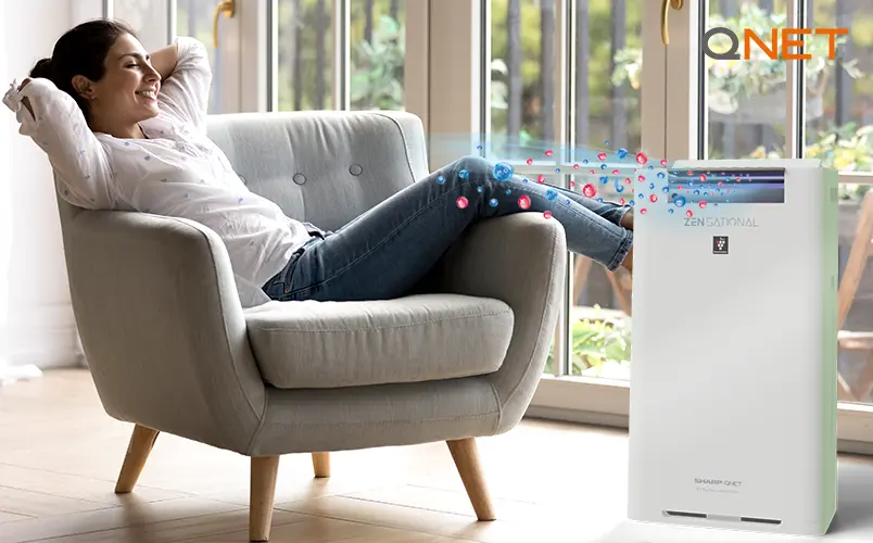 Young woman relaxing next to SHARP Zensational